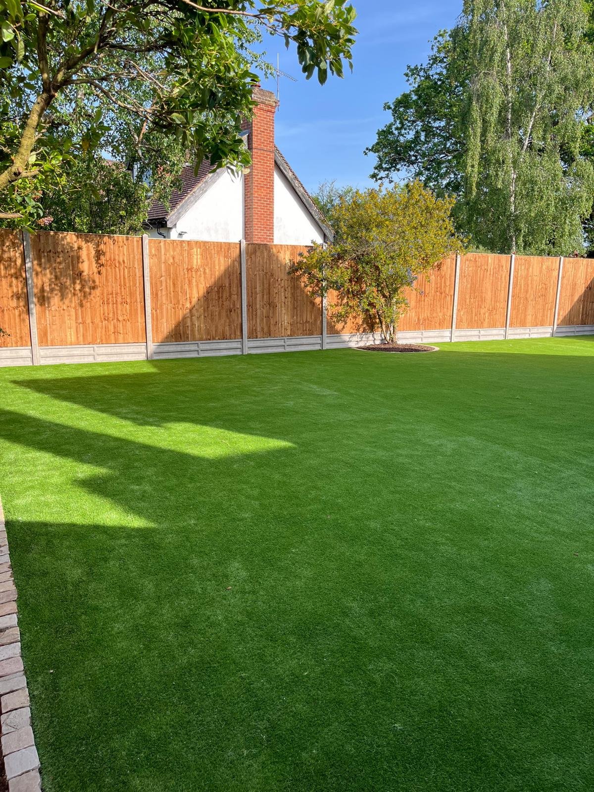 Artificial grass lawn installed by John Ruben Ltd in Potters Bar