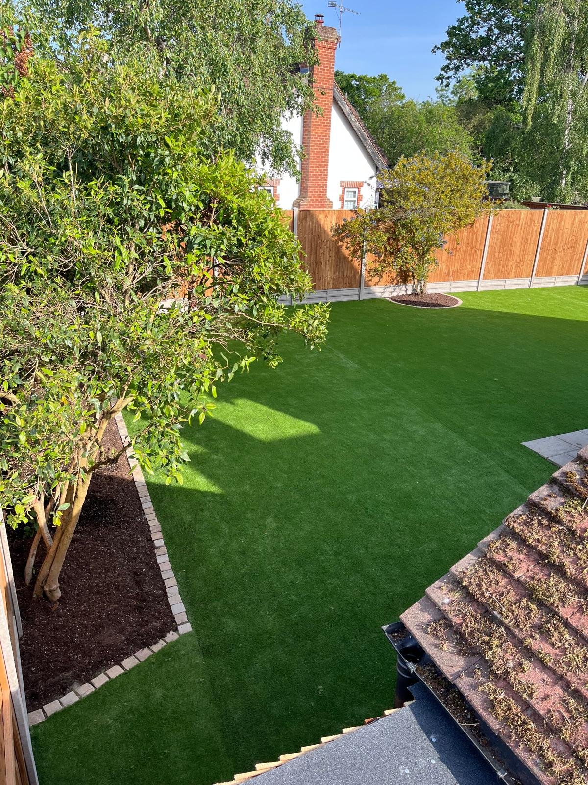 Artificial grass lawn installed by John Ruben Ltd in Potters Bar