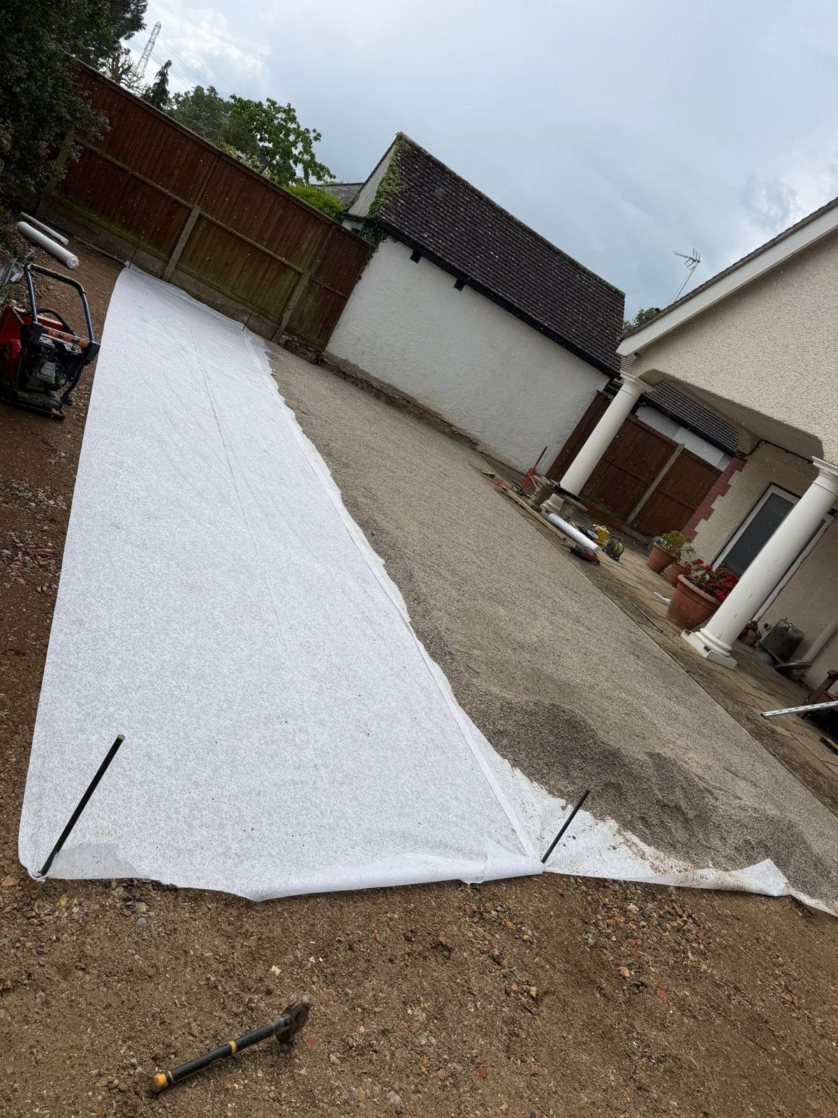 Artificial grass installation in progress by John Ruben Ltd in Potters Bar