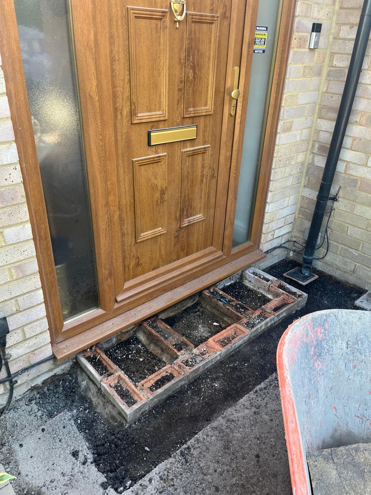 Broken brick doorstep removed before rebuilding by John Ruben Ltd in Potters Bar